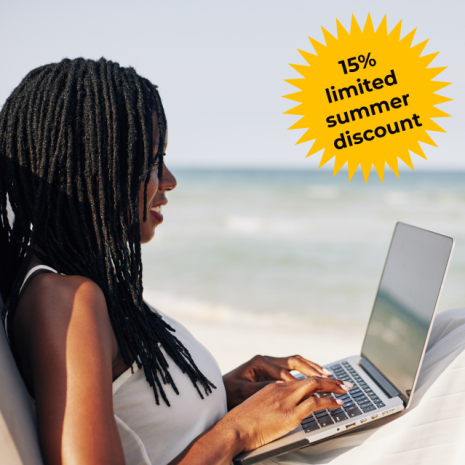 A woman with long plaited hair works on a laptop by the beach, exploring professional training courses. A yellow starburst in the corner says, "15% limited summer discount." The sea and sky are visible in the background.