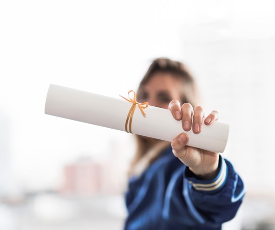 Student receiving certifcate after completing a course