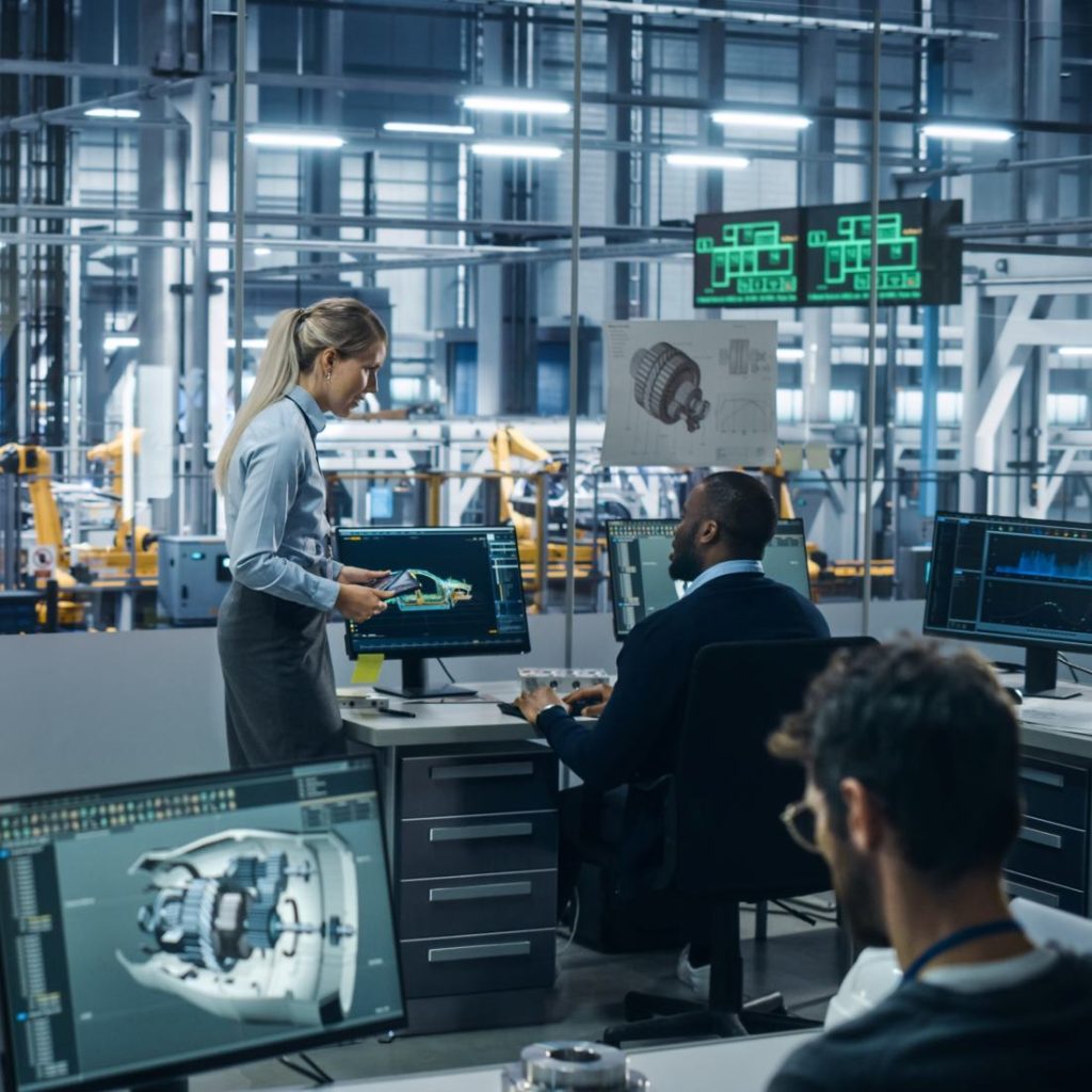 Automotive engineers collaborating in a digital design environment, illustrating ASPICE training for process improvement